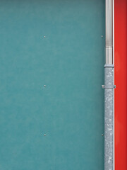 Wastewater pipe on a two-tone facade