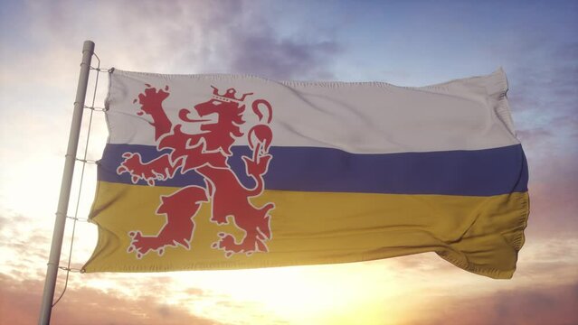 Limburg flag, Netherlands, waving in the wind, sky and sun background