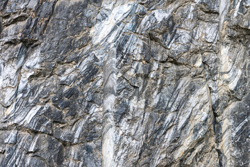 Marble surface with veins and a beautiful pattern on an industrial quarry. Karelia. Russia