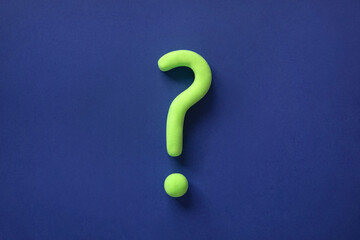 Green question mark on blue background. Abstract 3d model, mock-up of interrogation point. Asking...