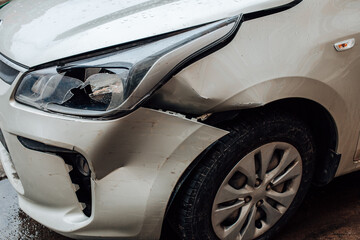 Close up view of broken bumper and damage to the auto after road accident. Car damage insurance,...