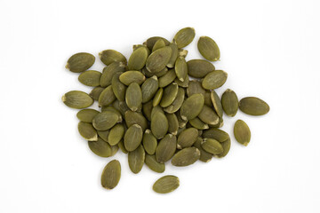 heap of green pumpkin seeds, close up