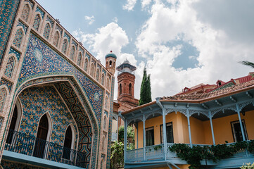 Narikala, Jumah Mosque, famous colorful balconies in old historic district Abanotubani. Exterior of public Sulphur bath in Tbilisi Georgia a fine example of islamic architectural style.