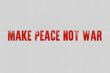 The inscription on the cardboard Make peace, not war