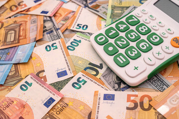 calculator on  dollar and the euro bills, exchange money