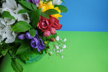 Composition of beautiful flowers. Pink, purple and yellow flowers on a blue or blue background. Flat lay, top view
