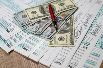1040 us tax form. financial docs with dollar on desk