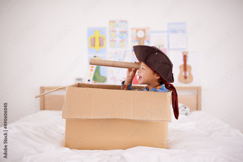 Sticker Shiver me timbers. A little pirate spying land from his cardboard box boat.