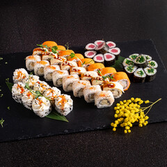 tasty sushi on the black stone