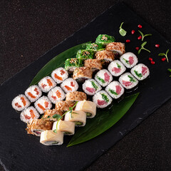 tasty sushi on the black stone