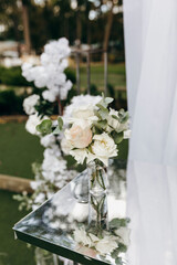 Elegant Wedding arch with fabric and flowers outdoors
