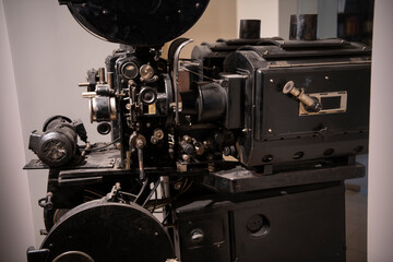Closeup photo of old vintage movie projector in cinema library.