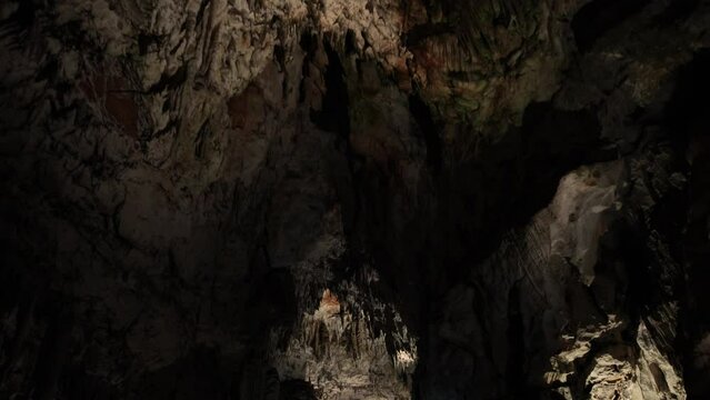 lighted cavern with stalactites and stalagmites. European cave