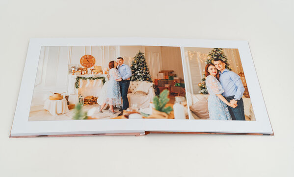 Photobook spread with photos of family photo shoot.