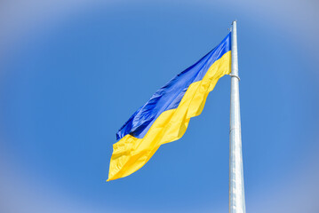 Flag of Ukraine on a background of blue sky