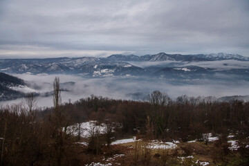 Fototapeta na wymiar Beautiful scenic view of snow covered mountains and forest in Serbia.