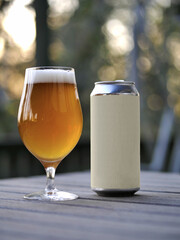 glass of IPA beer with can