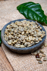 Green un-roasted and brown roasted coffee beans from Africa coffee producing region, cultivating in Ethiopia, Ivory Coast, Uganda, Kenya, Rwanda and Tanzania