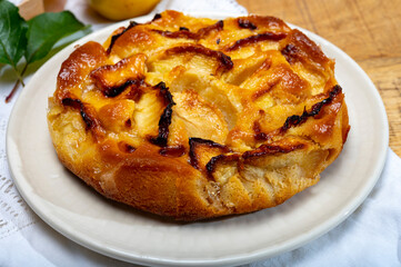Baked apple cake with almond frangipani custard close up
