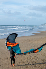 Water sport at cold winter water of Tyrrhenian sea between two touristic towns Sperlonga and Terracina in Lazio, Italy