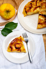 Baked apple cake with almond frangipani custard close up