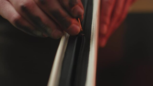 Artist hands opening zip of pencil case with paintbrushes for art, close-up. ProRes codec. Creativity, inspiration