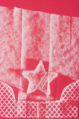 pastel chalk impression of a star in a basket with pattern