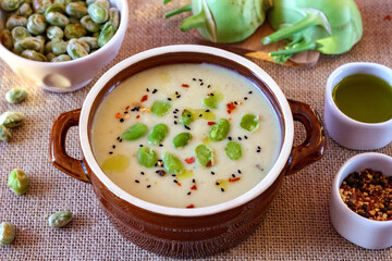 Kohlrabi cream soup with fried broad beans. A healthy vegetarian meal

