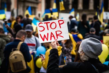 Foto op Aluminium Elderly Woman Holds Stop war Sign at a Demonstration in Support of Ukraine against Russia © Eduard Borja