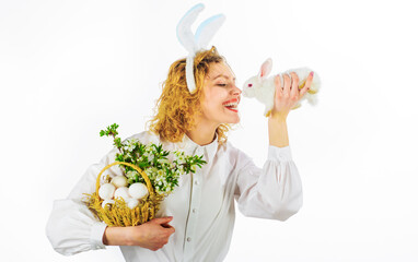 Easter. Happy Girl in rabbit ears with basket eggs and small bunny. Religion symbol. Spring holiday.