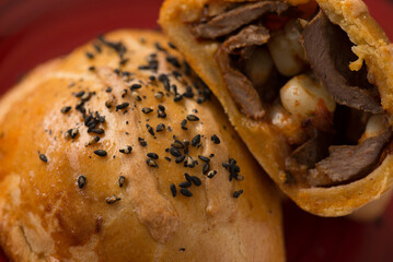 DETAIL OF TYPICAL PERUVIAN MEAT EMPANADA