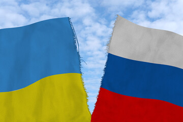 Two national flags of Russia and ukraine are torn apart by fabric, close-up, the concept of a...