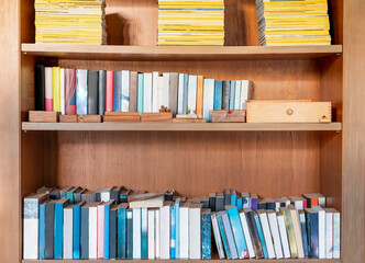 Books on the bookshelf in the living room for owner would to relaxing and reading in the freetime