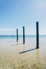 Boat ramp poles at Baudin beach in Kangaroo Island, South Australia