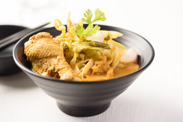 Khao Soi, Northern Thai food noodle red curry soup with coconut milk and chicken