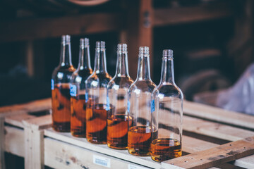 whiskey bottles with descending levels of fullness