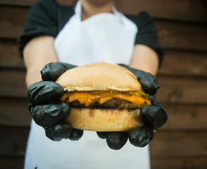 burger in the hands of a person