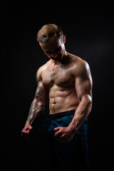 Fototapeta na wymiar Man on black background keeps dumbbells pumped up in fitness muscle sport, arm weight workout lifting heavy, Young handsome metal, people fit View from the bottom up good press beautiful muscles hairy
