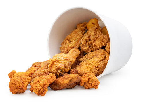 Fried chicken drop from falling paper bucket isolated on white background, Deep fried Chicken in paper bucket on white With clipping path.