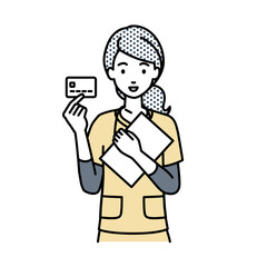 立って書類とカードを手に持つ看護師の女性