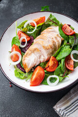 chicken salad breast vegetable tomato, onion, green lettuce mix leaves veggie fresh healthy meal food diet snack on the table copy space food background 