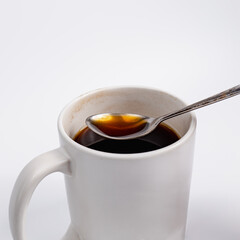 Scoop Americano black coffee in an old cup to see the clarity of the coffee. It's coffee that doesn't add sugar to the real coffee car. The taste is different. put on a white background