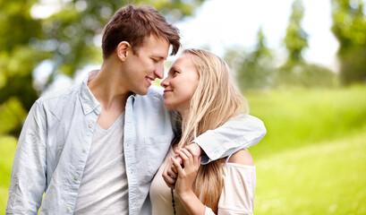 Theyve only got eyes for one another. Young couple standing together in the park.