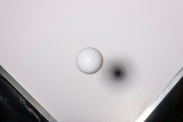 White plastic ball on white background