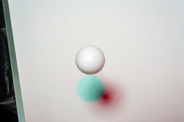 White plastic ball on white background