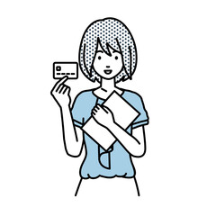 立って書類とカードを手に持つオフィスカジュアルの女性