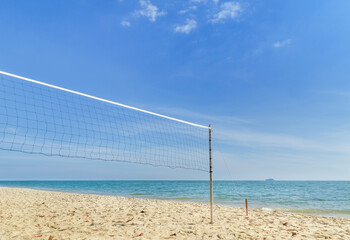 Landscape view tropical beach with volleyball net on empty sandy beach with blue sky in sunny day