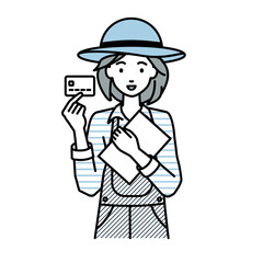 立って書類とカードを手に持つ農家の女性