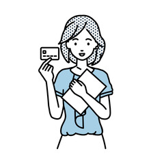 立って書類とカードを手に持つオフィスカジュアルの女性