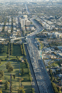 Aerial view of afternoon traffic on the 405 passing through Westwood Los Angeles